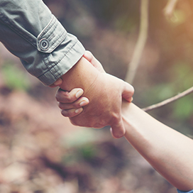 Friends lift up each other