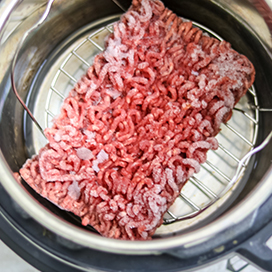 You shouldn't be putting cold food in the pan.