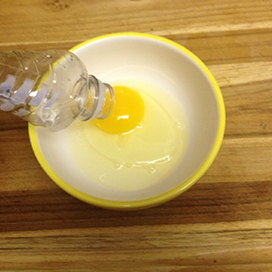 Use an empty water bottle to separate egg whites and yolks