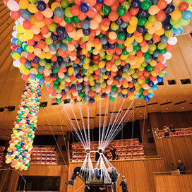 An Artist Lifted by 20,000 Balloons